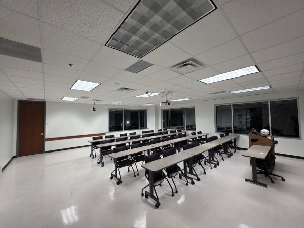 Wide-angle view of a modernized classroom featuring standardized A/V equipment and integrated technology infrastructure by The Brass Effect.